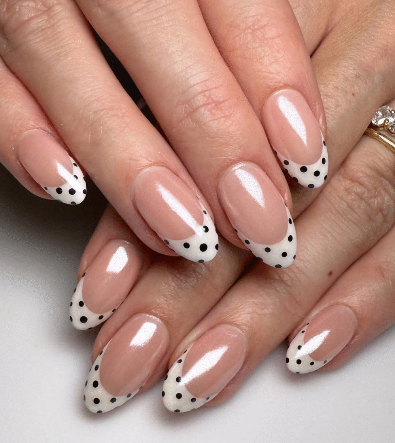 Micro polka dots on French manicure nails